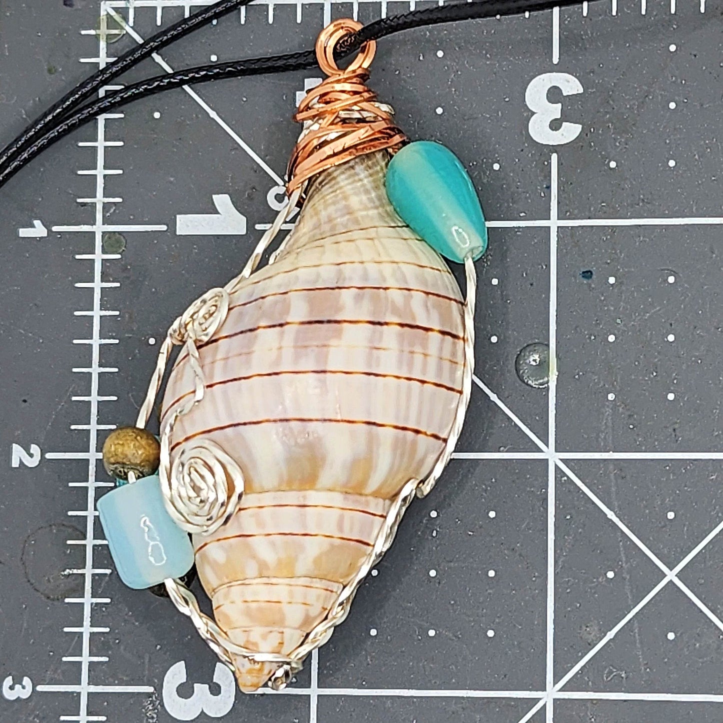 Handmade Banded Tulip Shell Pendant with Silver & Copper Wire Wrap, Blue/Turquoise Glass Beads, Wood Beads on Black Rope Necklace - SoFlo Boho Boutique