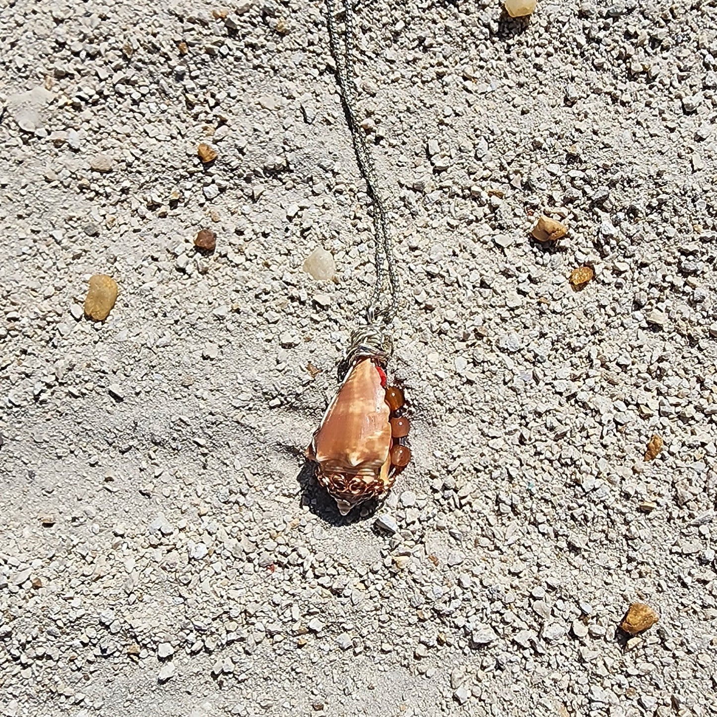 Handmade conch shell pendant necklace with silver wire wrap and coral orange beads