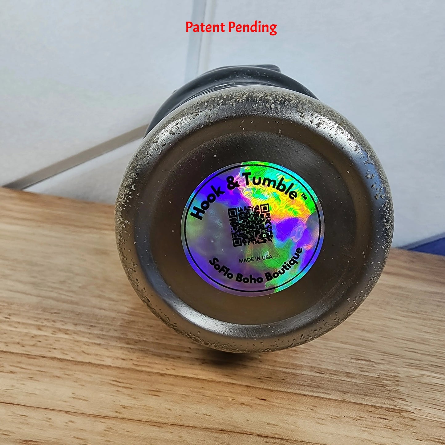 bottom view 30oz fishing hook tumbler black coastal stainless steel with sand texture and Hook & Tumble label