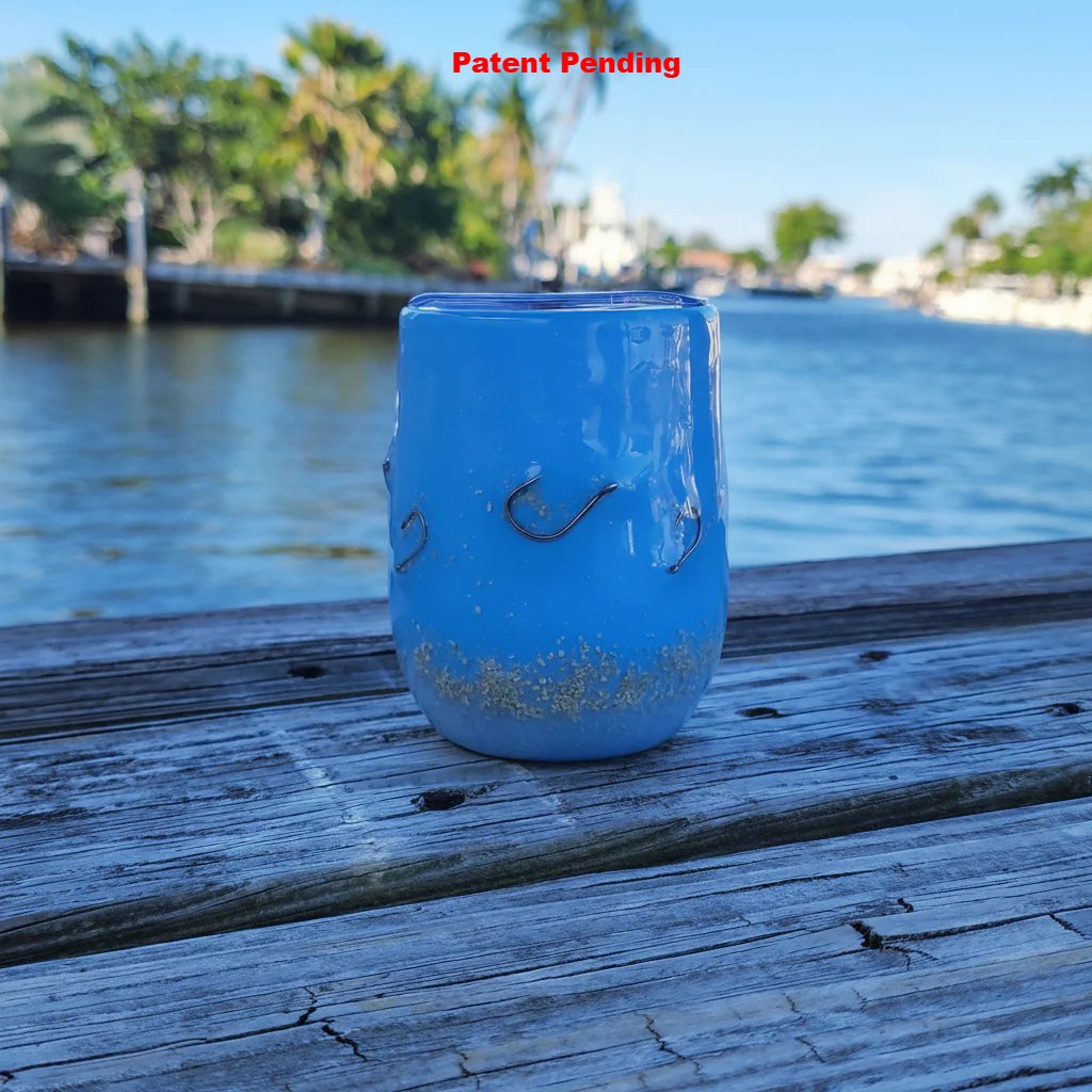 Side view of ocean blue Hook & Tumble™ coastal tumbler with real metal fishing hooks set in resin