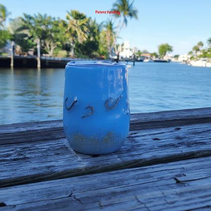 Side view of ocean blue Hook & Tumble™ coastal tumbler with real metal fishing hooks set in resin
