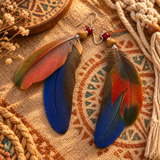 Handmade blue green feather earrings with white howlite, wood, and coral-colored beads, long coastal dangle earrings