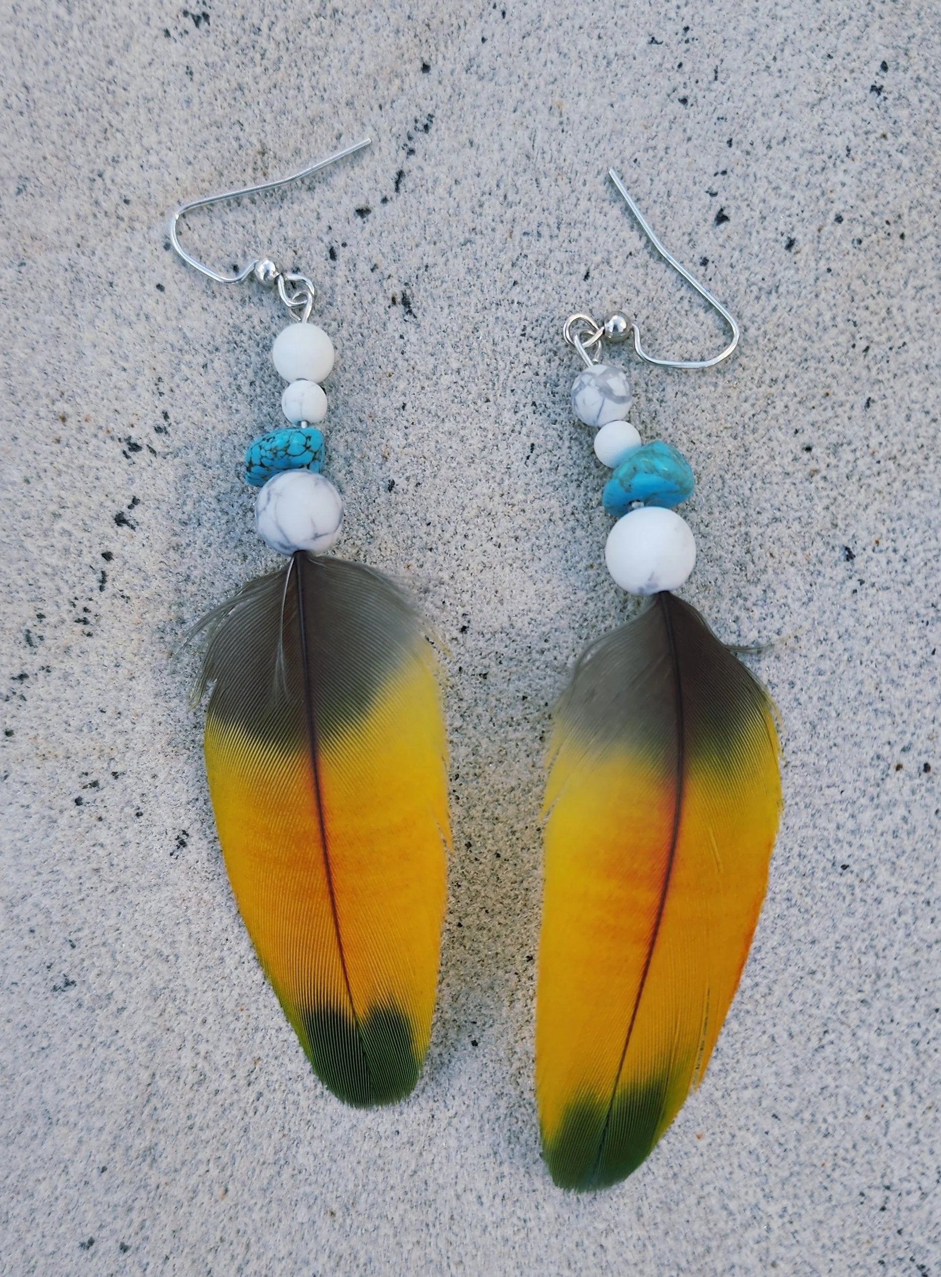 Feather Earring turquoise and white howlite close up laying flat