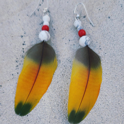 Yellow Feather Earring with white howlite and red bead flat close up