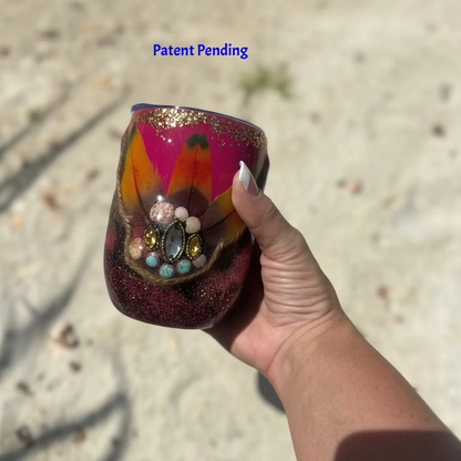 Magenta boho Saltwater Sips™ 12oz wine tumbler held in hand, exotic feathers shells howlite rhinestones, Patent Pending