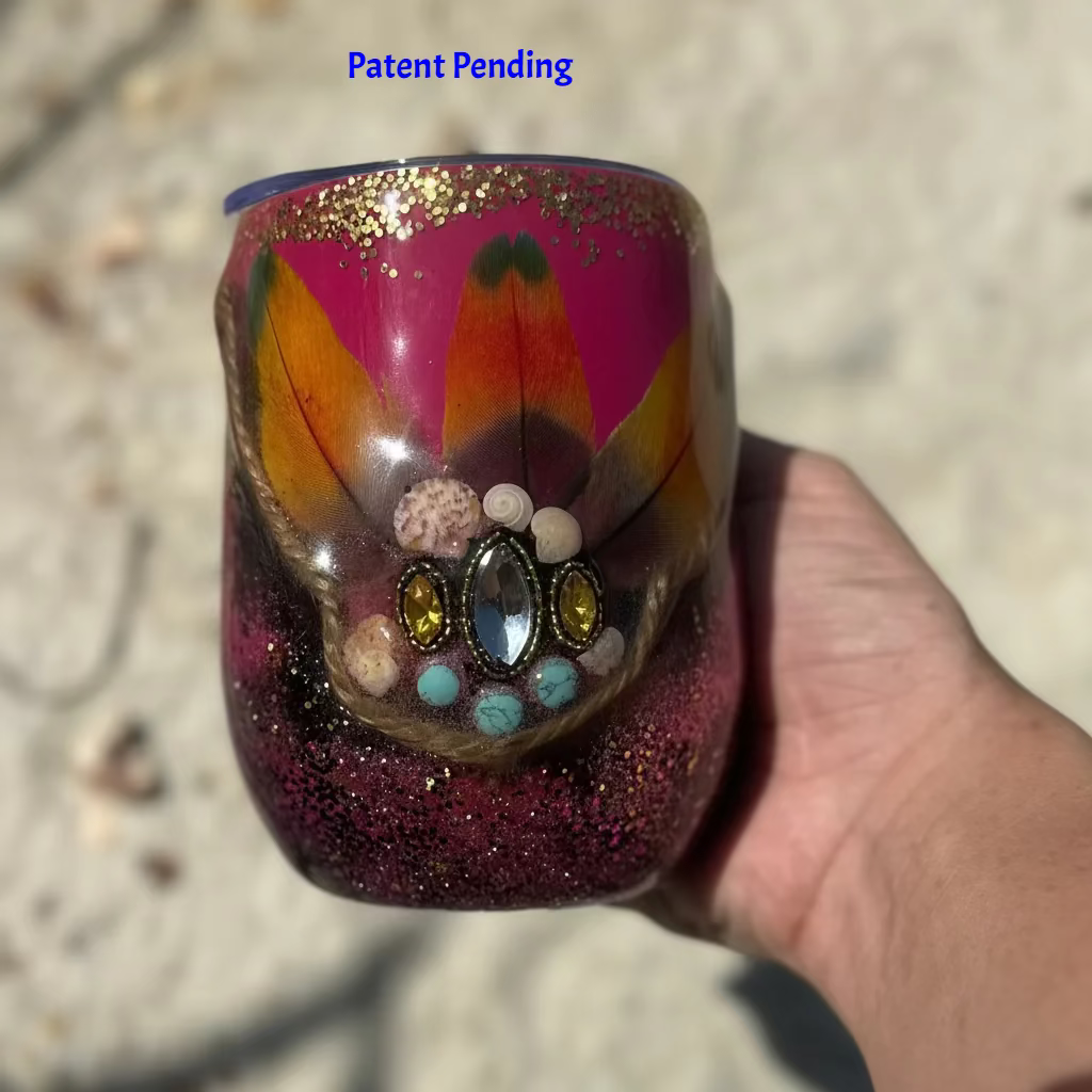Magenta boho Saltwater Sips™ 12oz wine tumbler held in hand, exotic feathers shells howlite rhinestones, Patent Pending