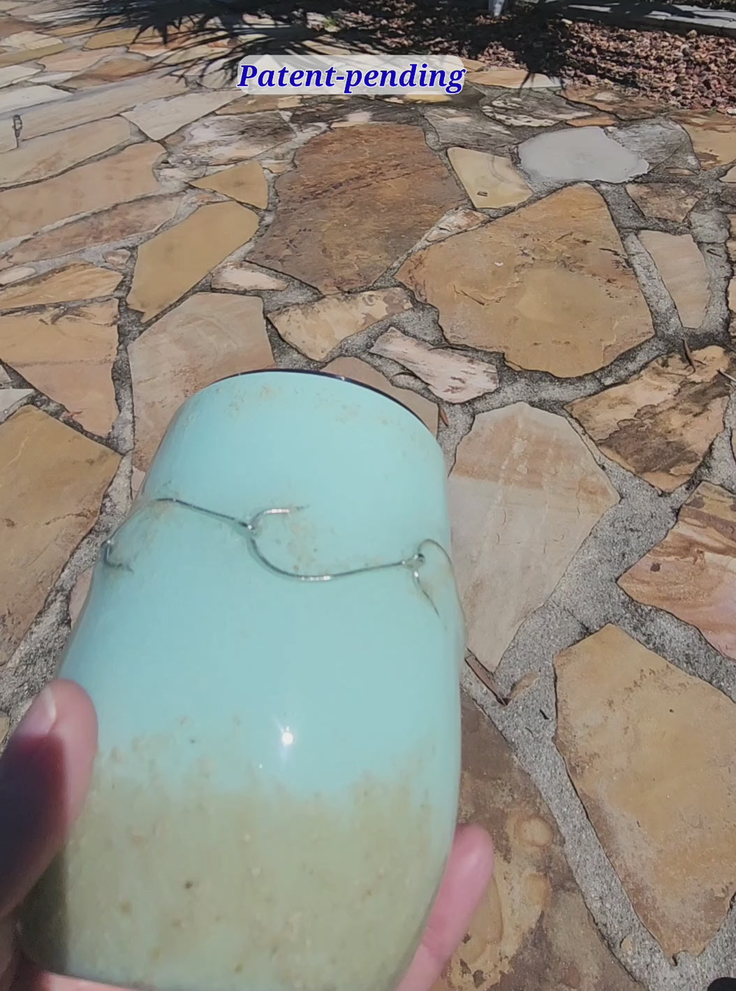 Video of a handmade 12oz teal fishing hook tumbler with real fishing hooks and sand held in hand