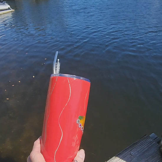 Red Saltwater Sips seashell tumbler on dock by water – coastal cowgirl cup 20oz