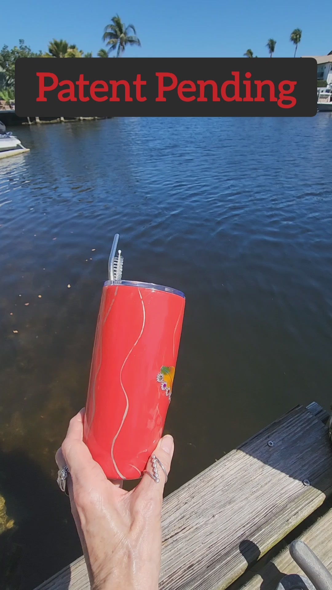 Red Saltwater Sips seashell tumbler on dock by water – coastal cowgirl cup 20oz