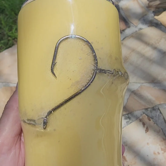 Golden Hour 20oz Hook & Tumble fishing tumbler rotating video showing authentic fishing hook and sand accent on golden yellow, dock and boat setting