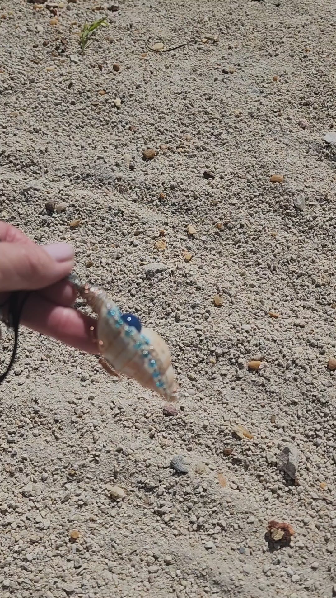 Handmade tulip shell pendant necklace with copper wire wrap, blue ceramic bead, and glass beads on cord