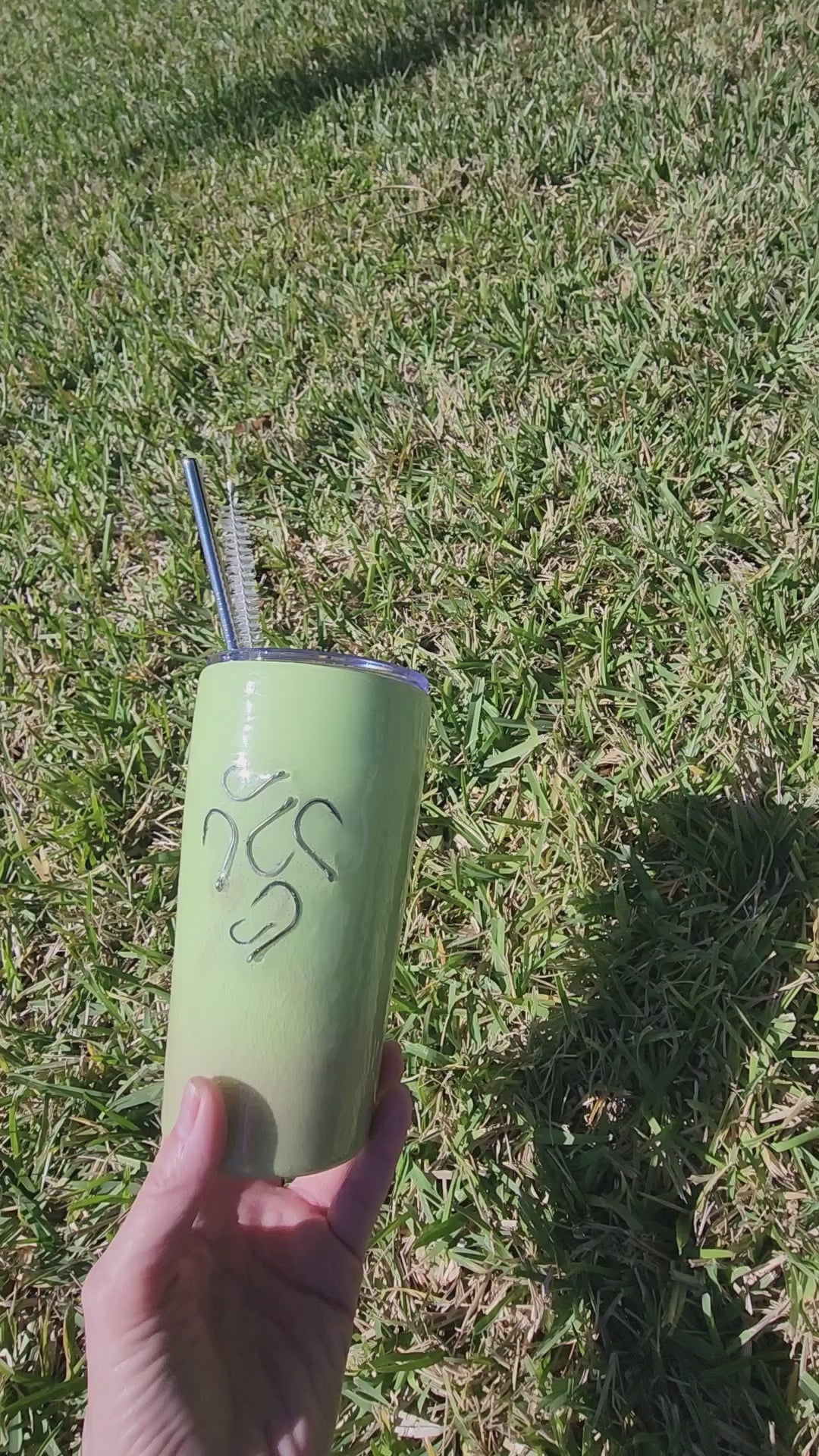 Lime green fish hook tumbler with real sand and epoxy resin, insulated coastal drinkware