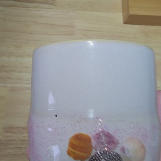 Close up video of coastal mug held in heand and turned