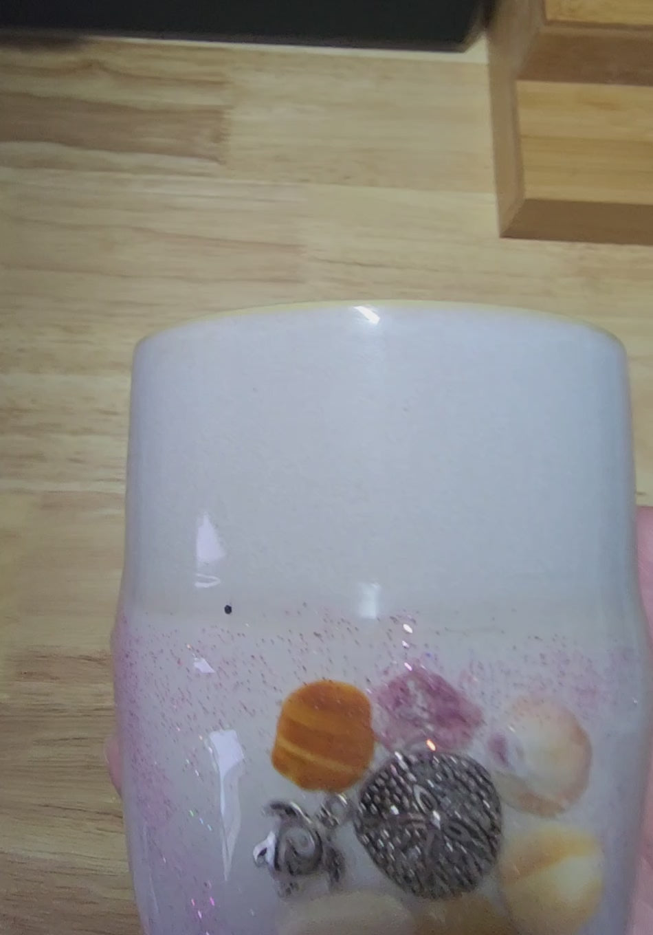 Close up video of coastal mug held in heand and turned