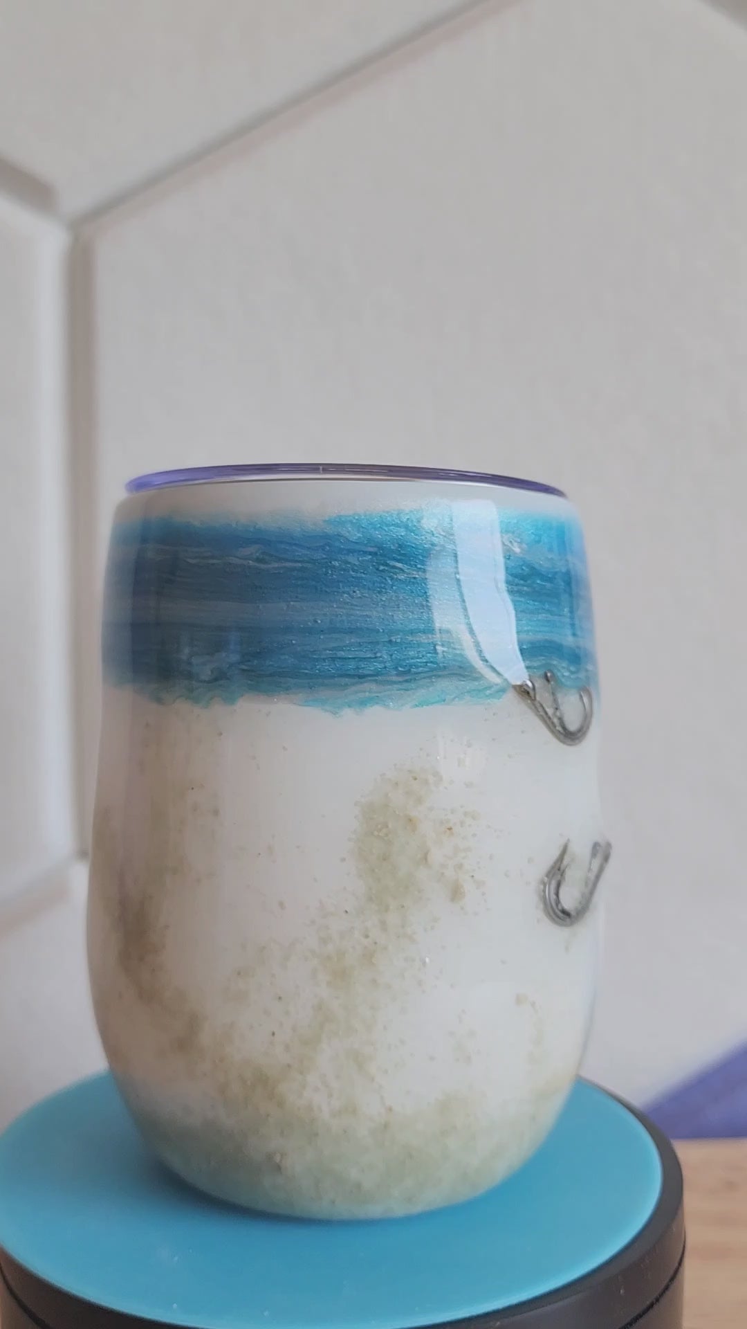  Video Ocean Fade Hook & Tumble™ 12oz wine tumbler on dock – hand-painted blue to white fade with real fishing hooks and sand handmade South Florida
