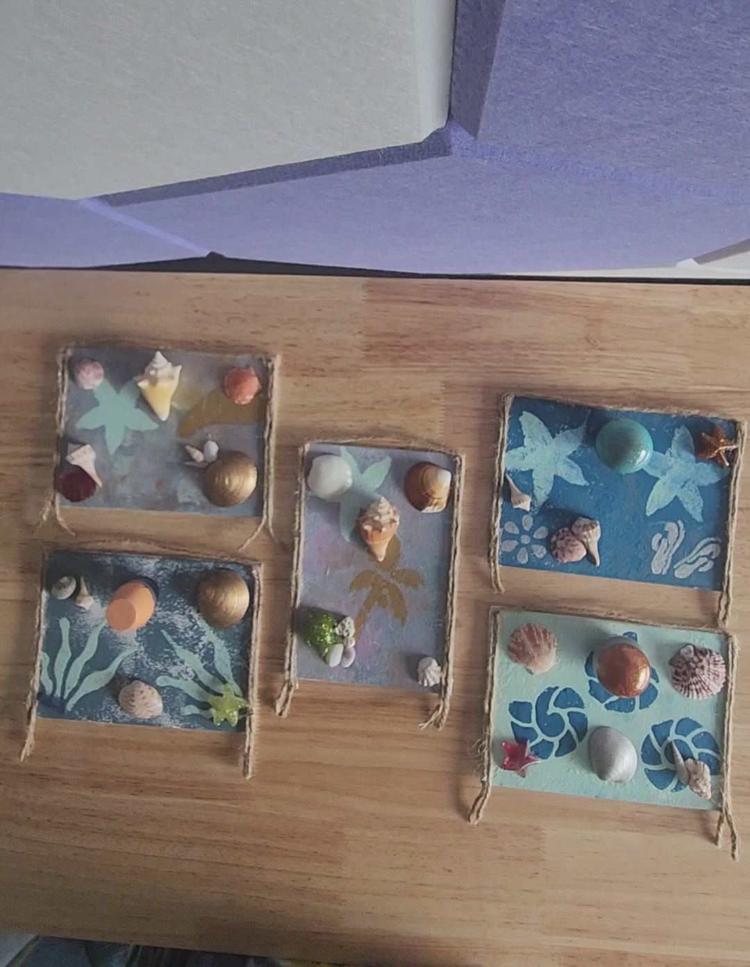  video of five seashell jewelry holder wall decor with real shells and resin accent, handmade coastal wall art