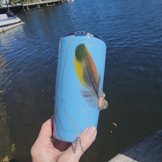 Blue Saltwater Sips seashell tumbler on dock by water – handmade coastal cowgirl drinkware 20oz