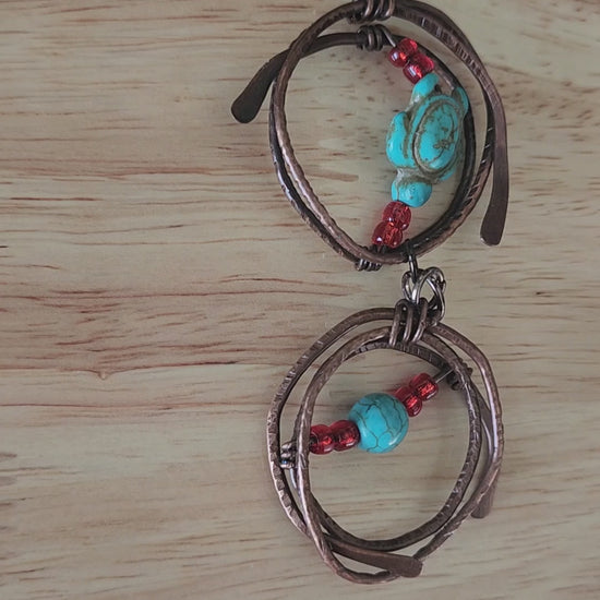Copper pendant necklace with turquoise howlite turtle and red glass beads -video close up