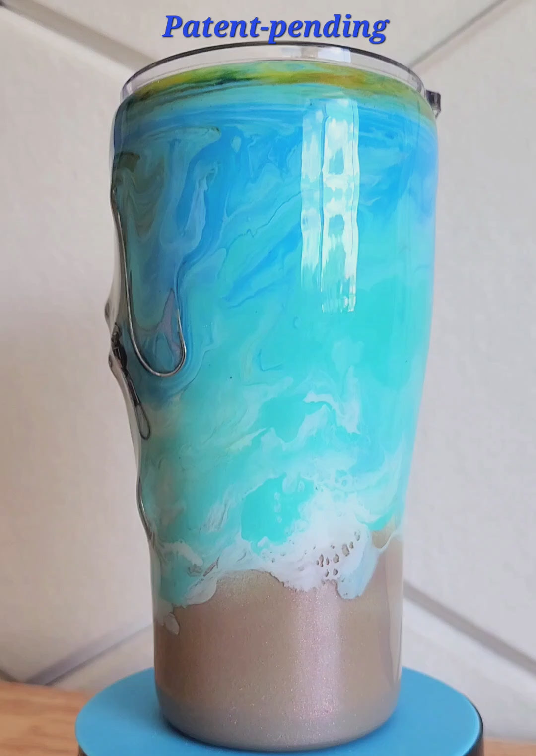 Hook & Tumble™ 20oz turquoise ocean wave fishing hook tumbler 360 degree view, real hooks and barrel swivels