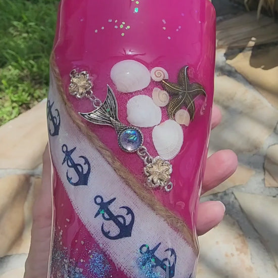 Video preview showcasing the handcrafted 20oz Saltwater Sips beach tumbler being turned in natural sunlight to display the 3D depth of the real embedded shells, shimmering ocean waves, and glass-smooth finish.
