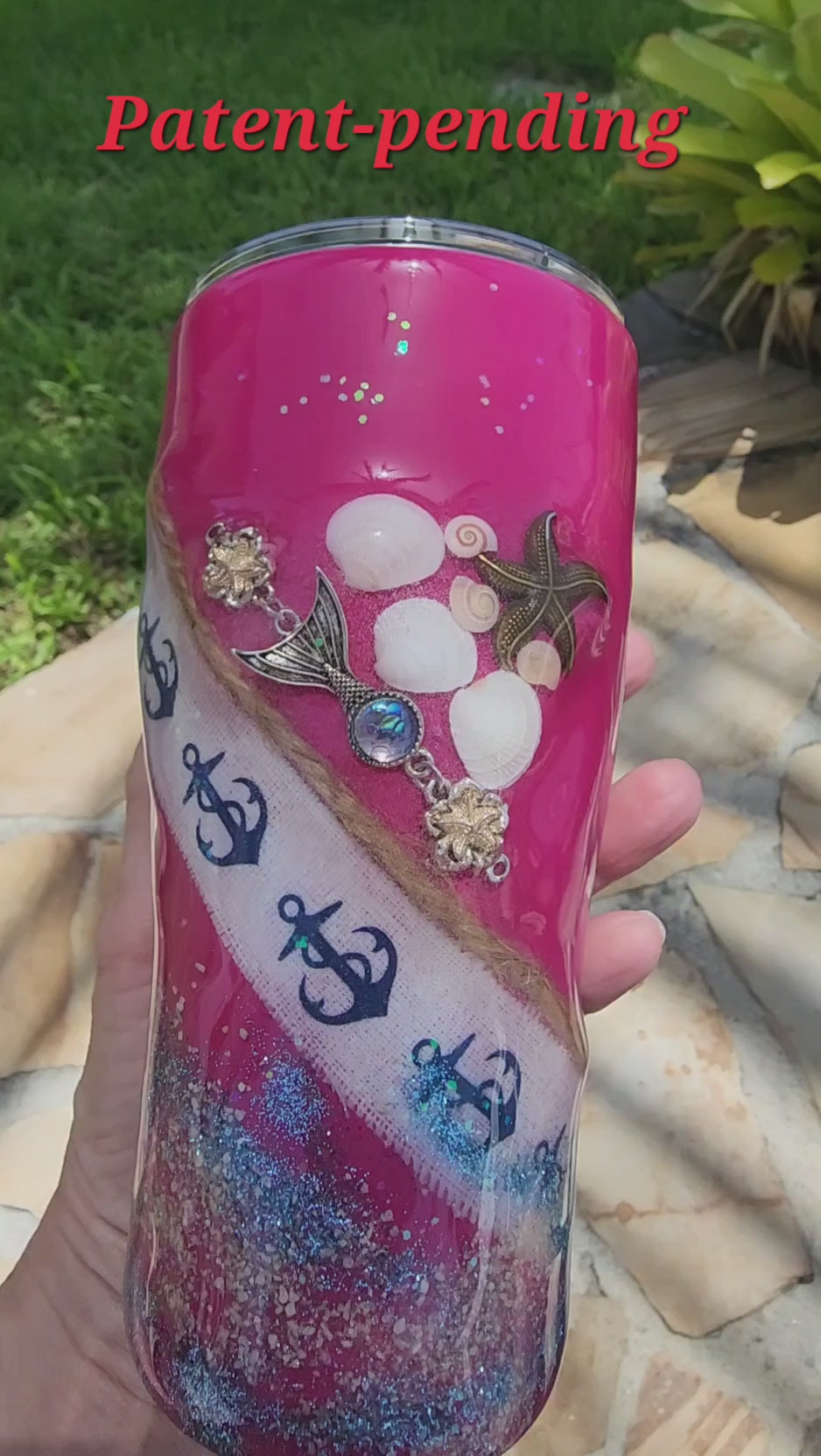 Video preview showcasing the handcrafted 20oz Saltwater Sips beach tumbler being turned in natural sunlight to display the 3D depth of the real embedded shells, shimmering ocean waves, and glass-smooth finish.