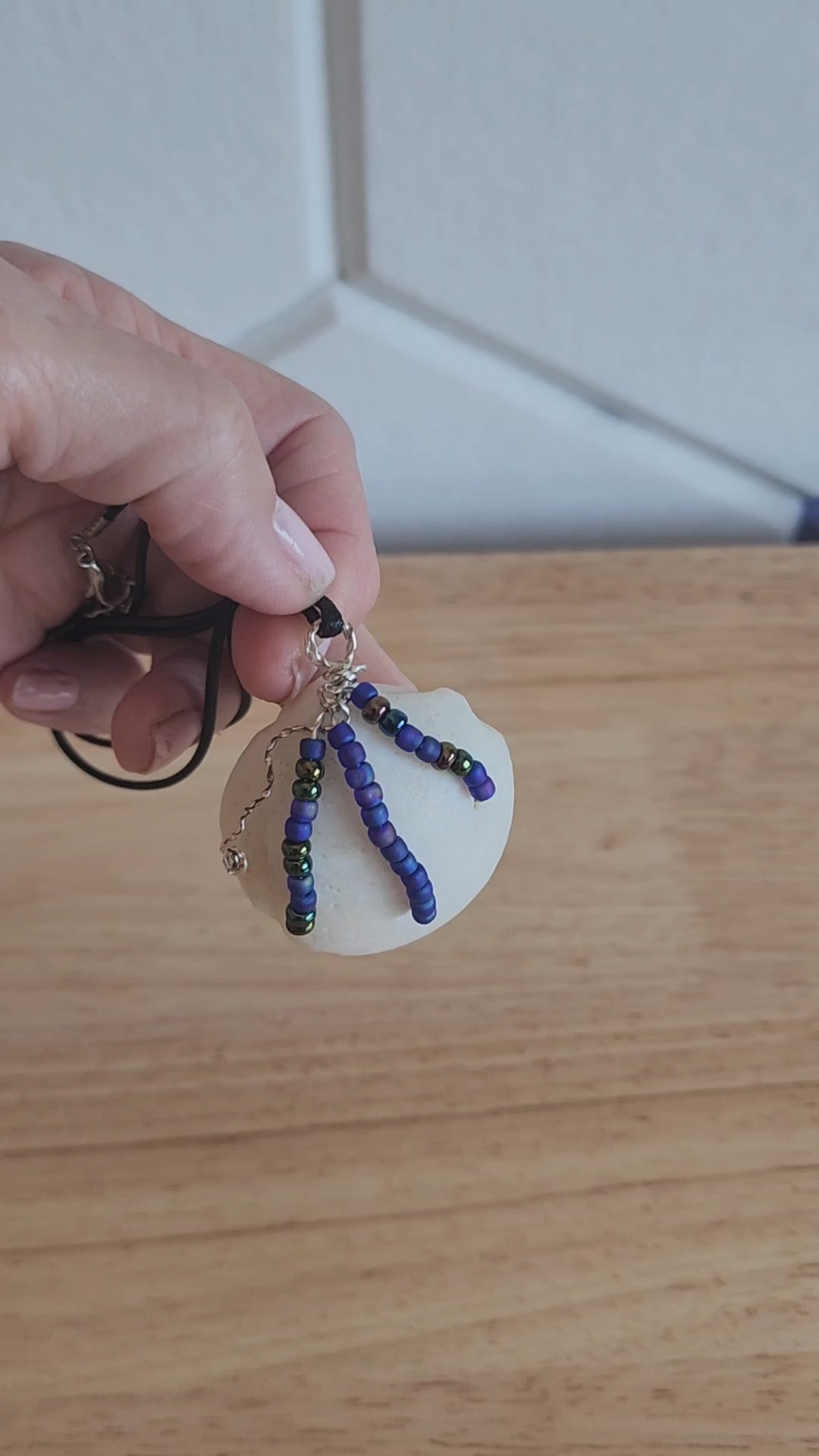 Handmade Lucina shell pendant necklace with silver wire wrap and multicolor bead strands video