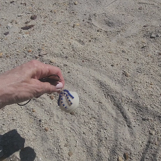 Handmade Lucina shell pendant necklace with silver wire wrap and purple bead strands, video 