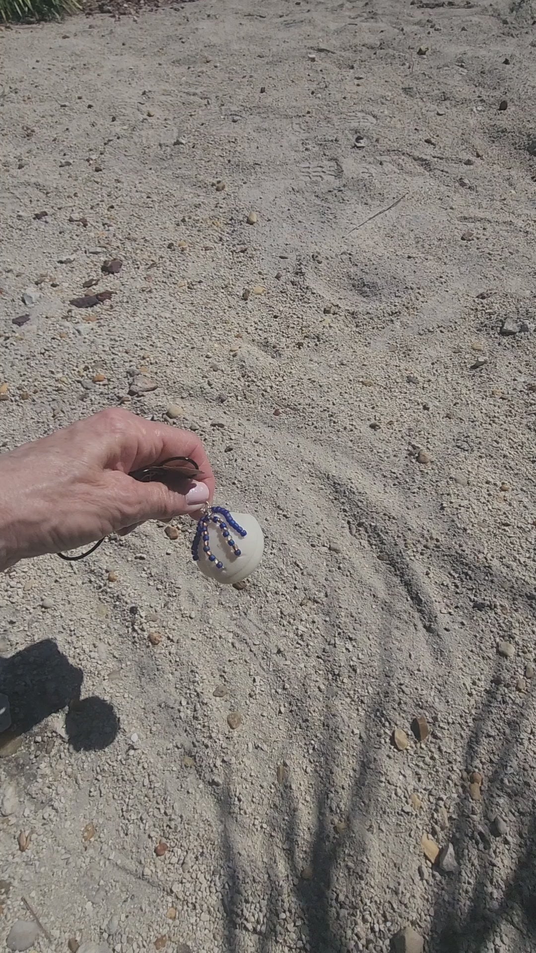 Handmade Lucina shell pendant necklace with silver wire wrap and purple bead strands, video 