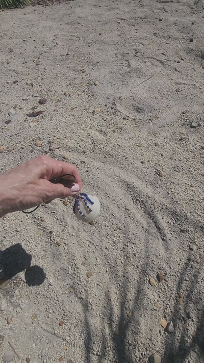 Handmade Lucina shell pendant necklace with silver wire wrap and purple bead strands, video 
