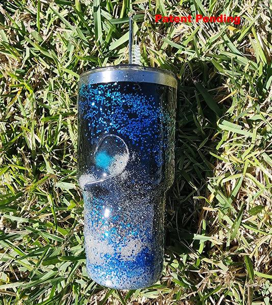 Saltwater Surge 30oz fishing hook tumbler with layered blue glitter and real sand epoxy design on beach