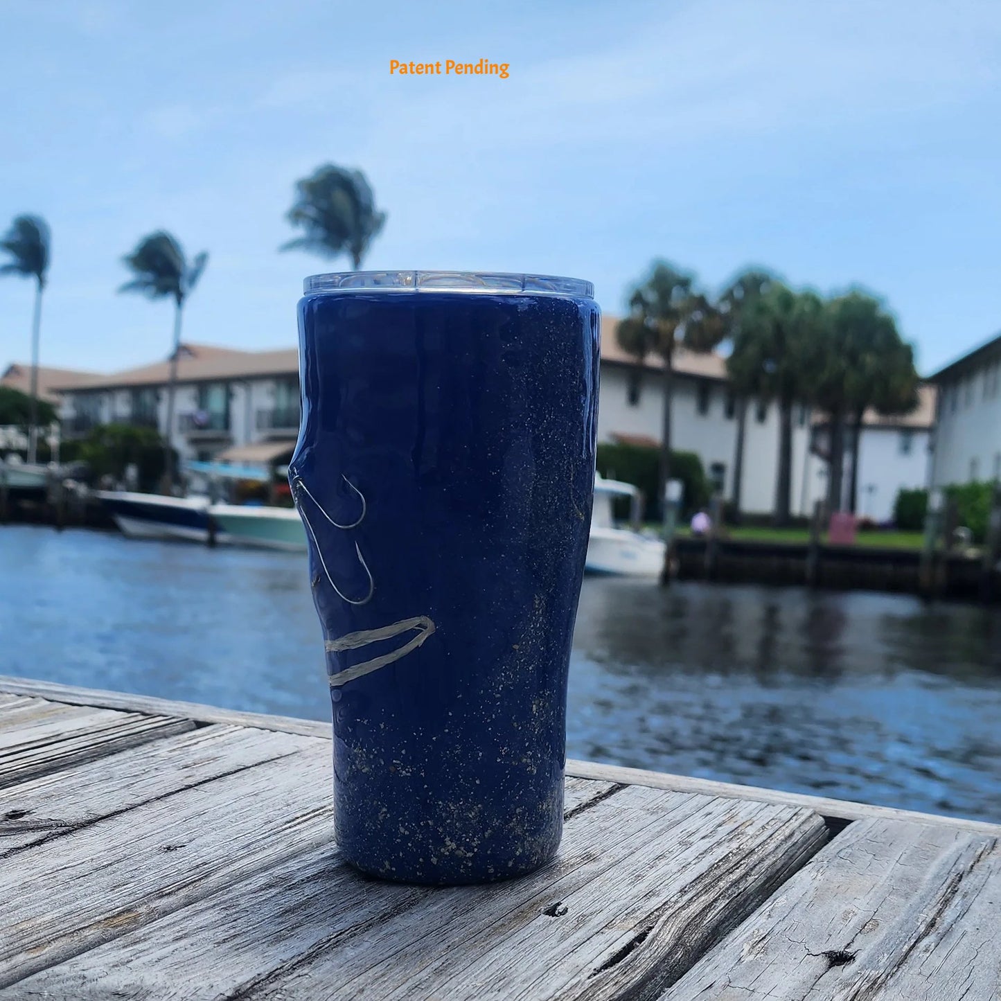 Handmade 20oz Blue left side view Ink fishing hook tumbler with real saltwater hooks, barrel swivel and natural raffia, Hook & Tumble coastal drinkware