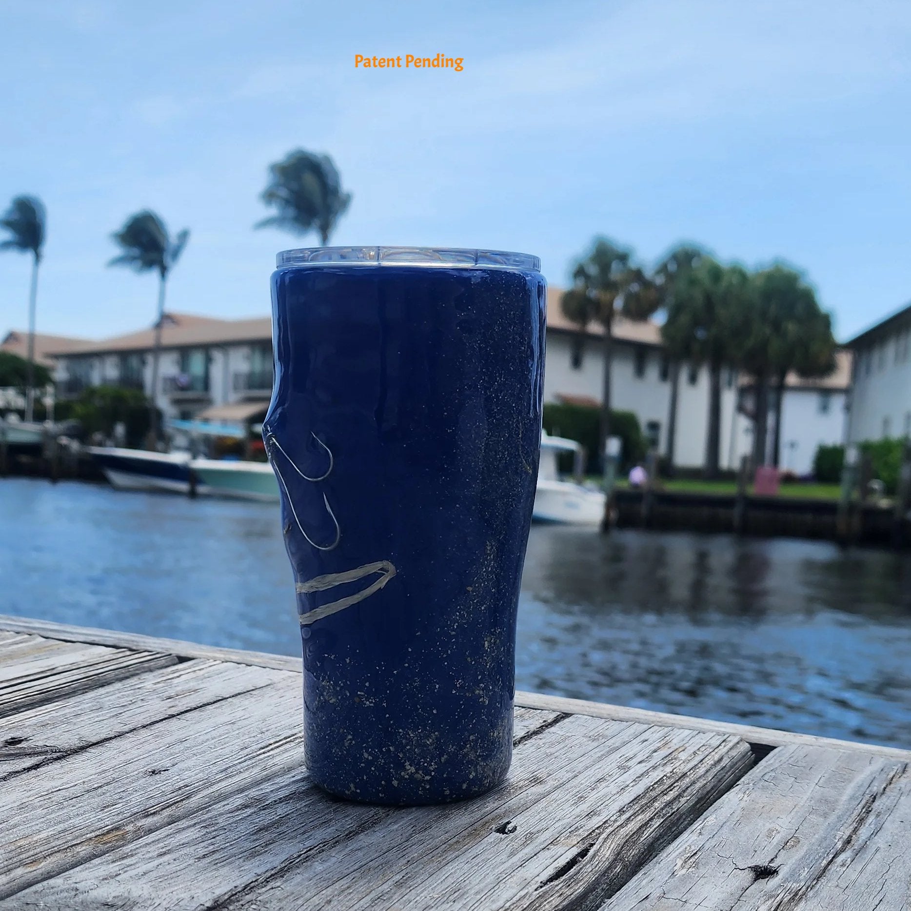 Handmade 20oz Blue left side view Ink fishing hook tumbler with real saltwater hooks, barrel swivel and natural raffia, Hook & Tumble coastal drinkware