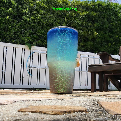 Left side view of Caribbean Glow Shell Glitter 30oz tumbler showing real seashells and holographic iridescent glitter color shift in natural light. Saltwater Sips™ by SoFlo Boho Boutique, Patent Pending.