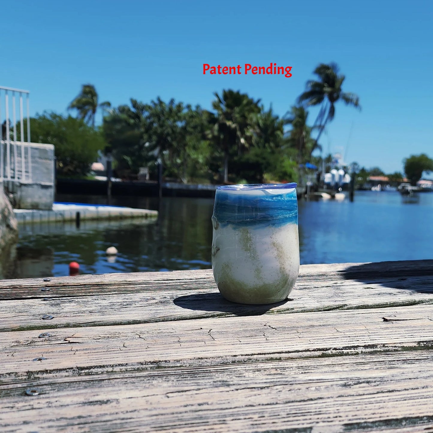 Ocean Fade Hook & Tumble™ 12oz wine tumbler on dock – hand-painted blue to white fade with real fishing hooks and sand handmade South Florida