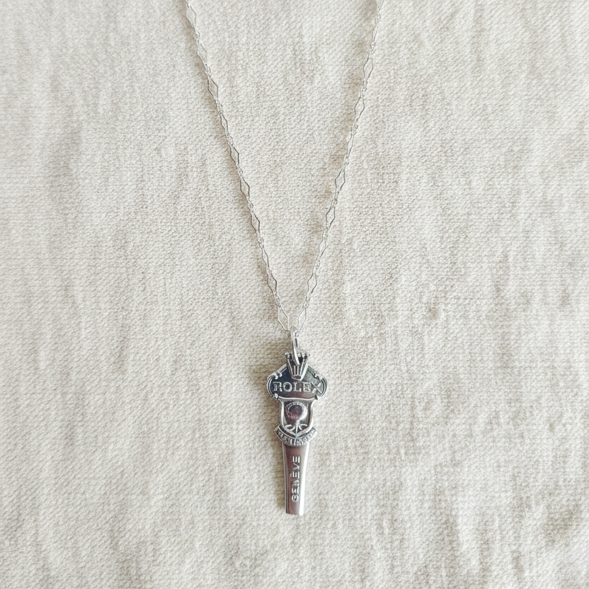 Close-up of Rolex vintage spoon handle pendant, genuine sterling silver chain necklace