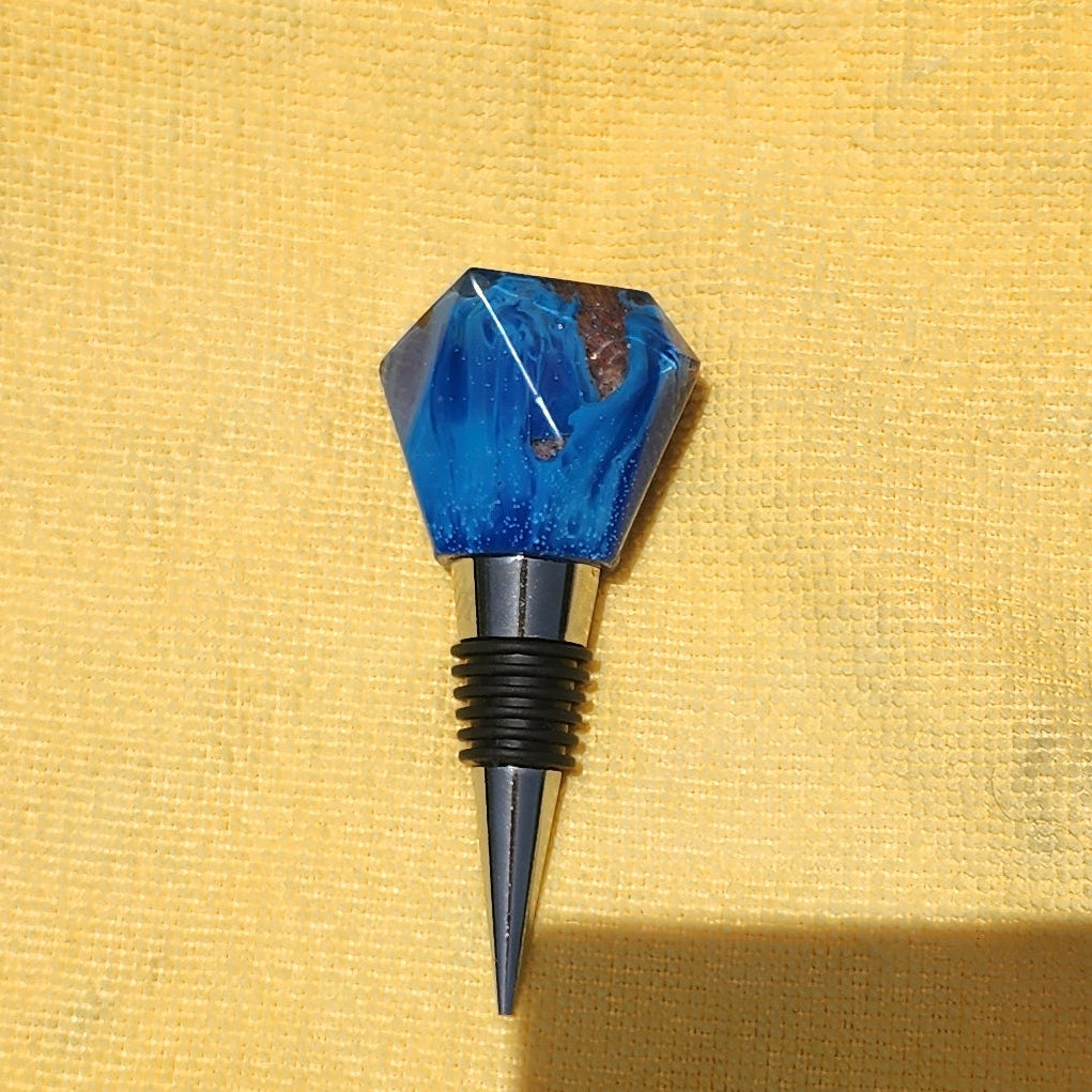 Geometric resin wine bottle stopper in sapphire blue, multiple angles