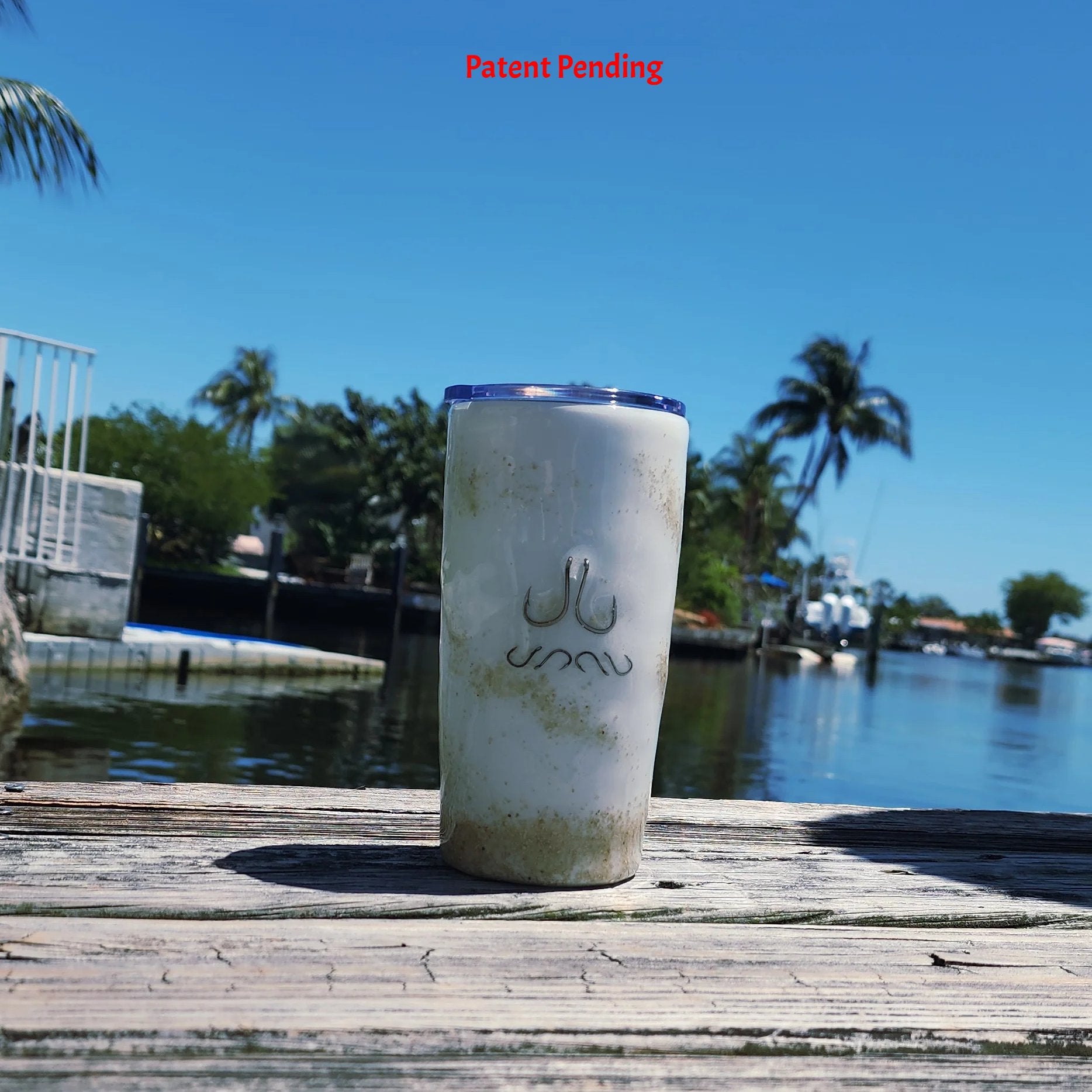 White Sands Hook & Tumble™ 20oz fishing hook tumbler on dock – real hooks artistically arranged in clear epoxy resin handmade South Florida