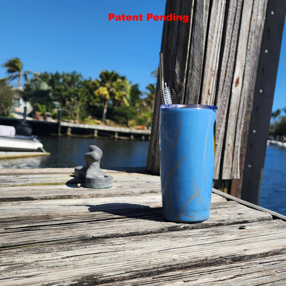 Blue Saltwater Sips seashell tumbler on dock by water – handmade coastal cowgirl drinkware 20oz