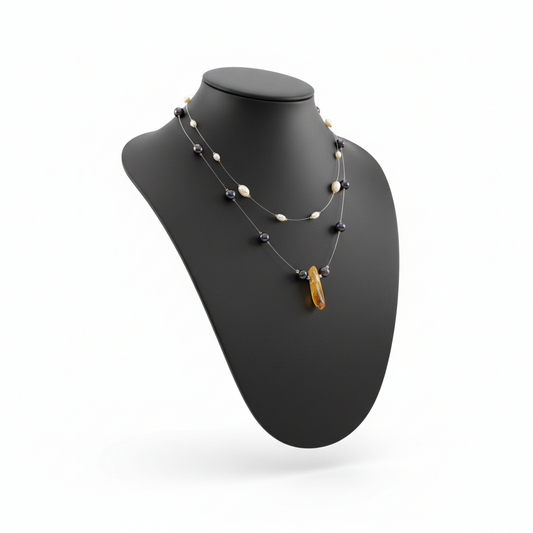 Handmade layered freshwater Pearl Necklace & Amber Quartz Crystal Statement Piece on a bust.