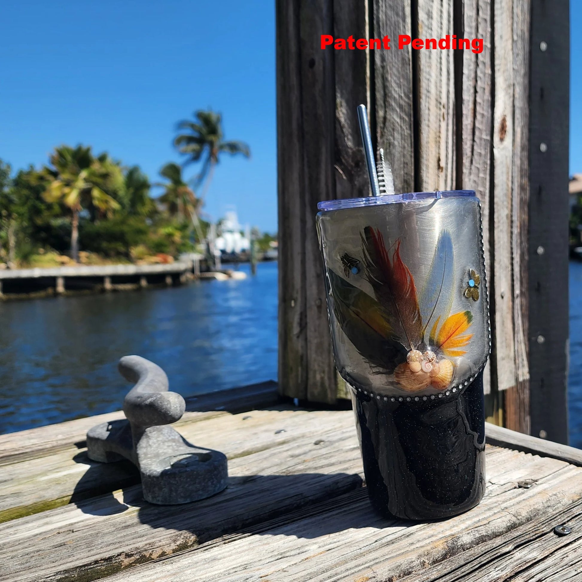 Black Saltwater Sips 30oz tumbler on dock by water – insulated coastal cowgirl drinkware