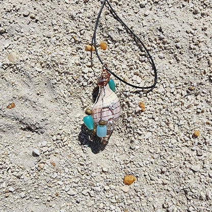 Handmade tulip shell pendant necklace with mixed metal wire wrap, turquoise beads, and wood accents on cord
