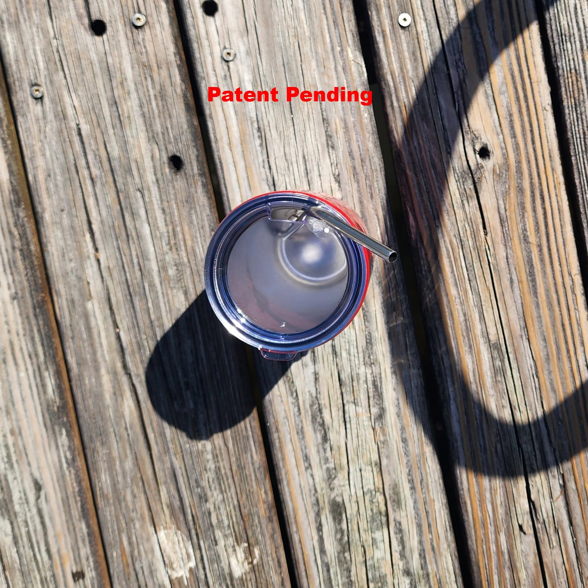 Top of red tumbler on a dock 