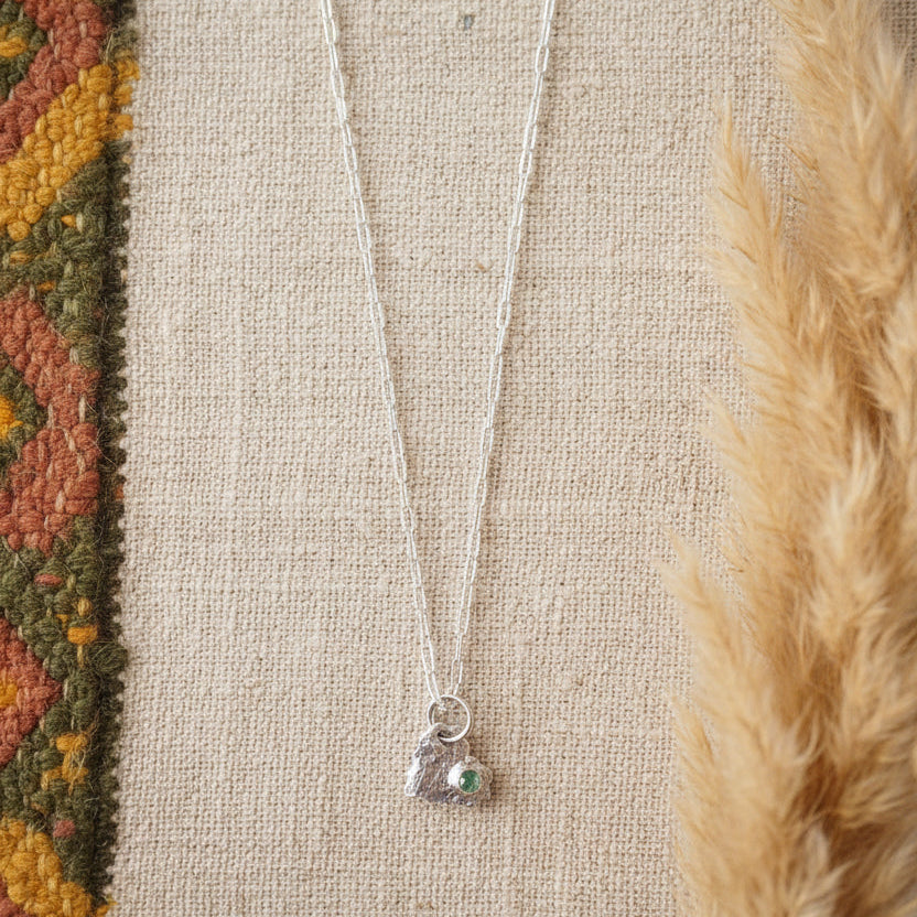 Fine silver pendant on boho display