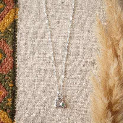 Fine silver pendant on boho display