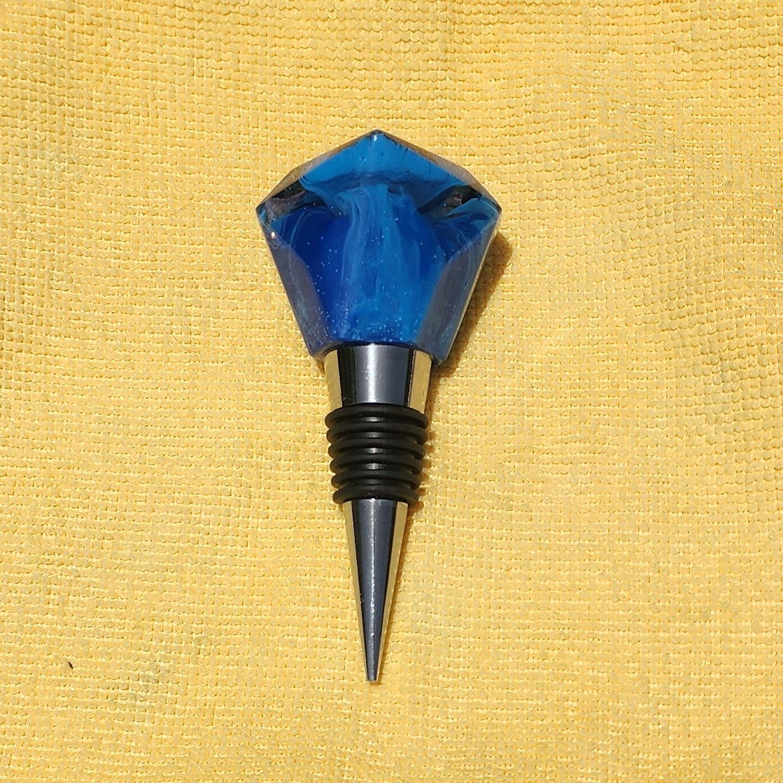 Geometric resin wine bottle stopper in sapphire blue, multiple angles