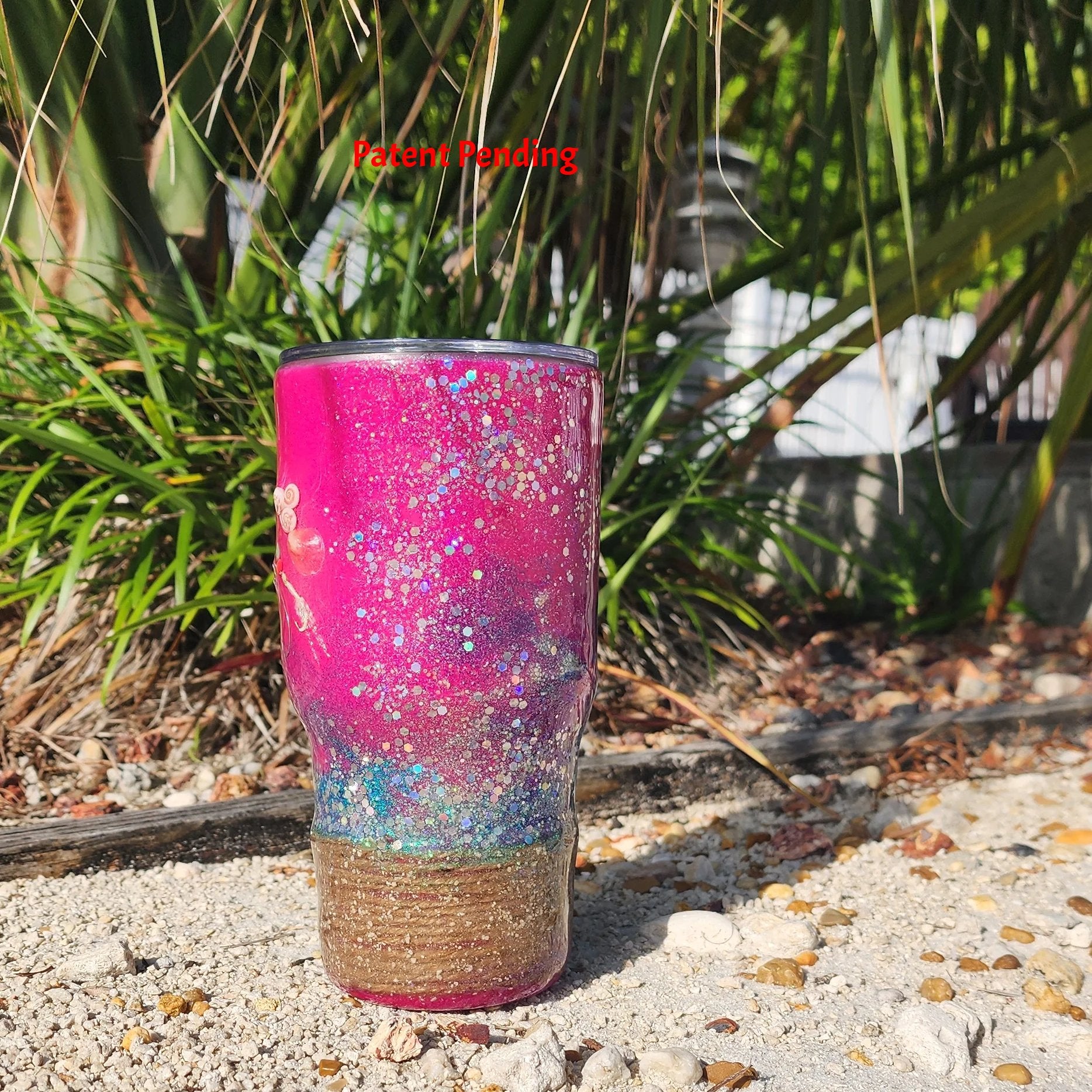 side view of magents 30 oz fish hook tumbler  with rope on the base
