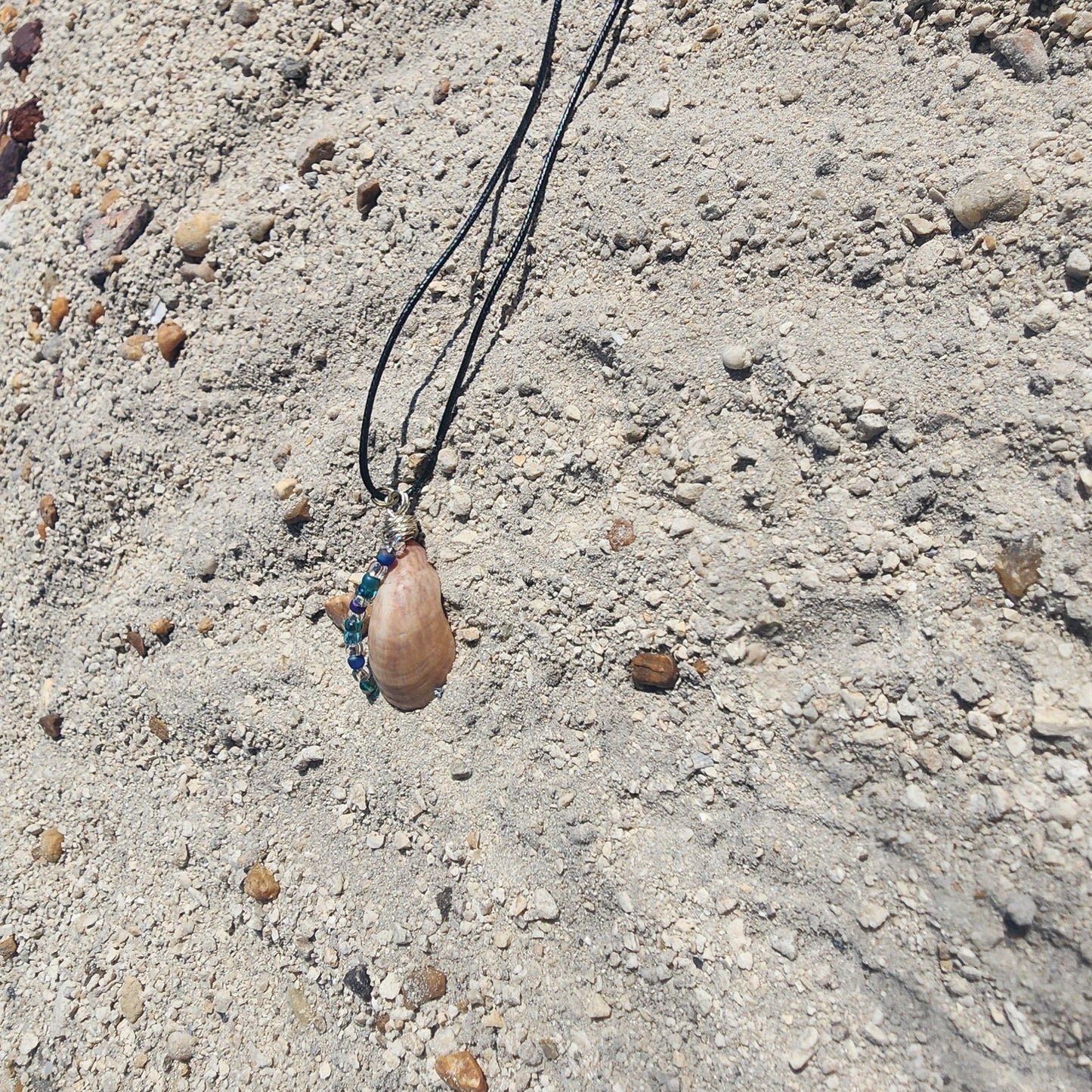 Handmade seashell pendant necklace with silver wire wrap and blue green beads