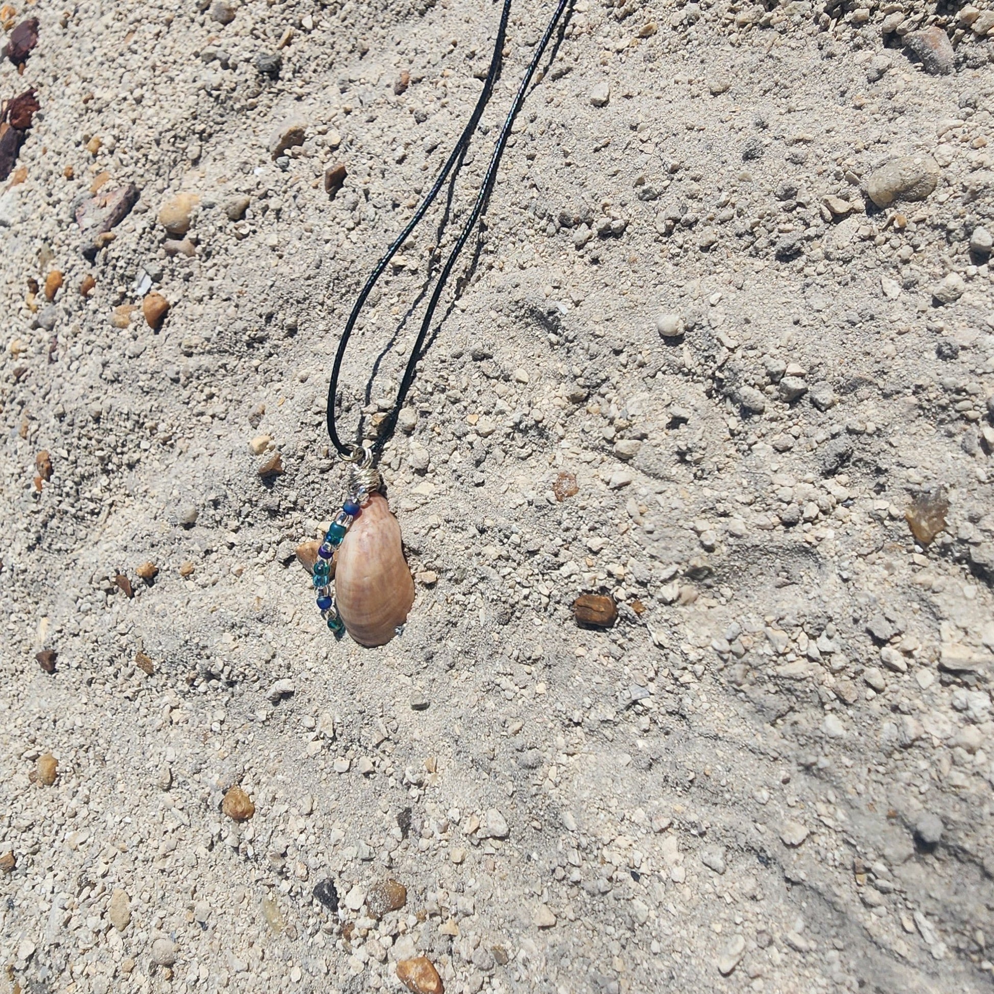 Handmade seashell pendant necklace with silver wire wrap and blue green beads
