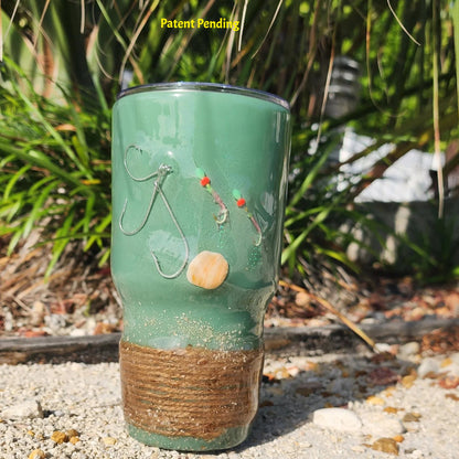 Marsh Tide 30oz Hook & Tumble fishing tumbler front view showing real fish hooks, glow in the dark shrimp hooks and seashell in crystal clear resin with natural rope wrapped base
