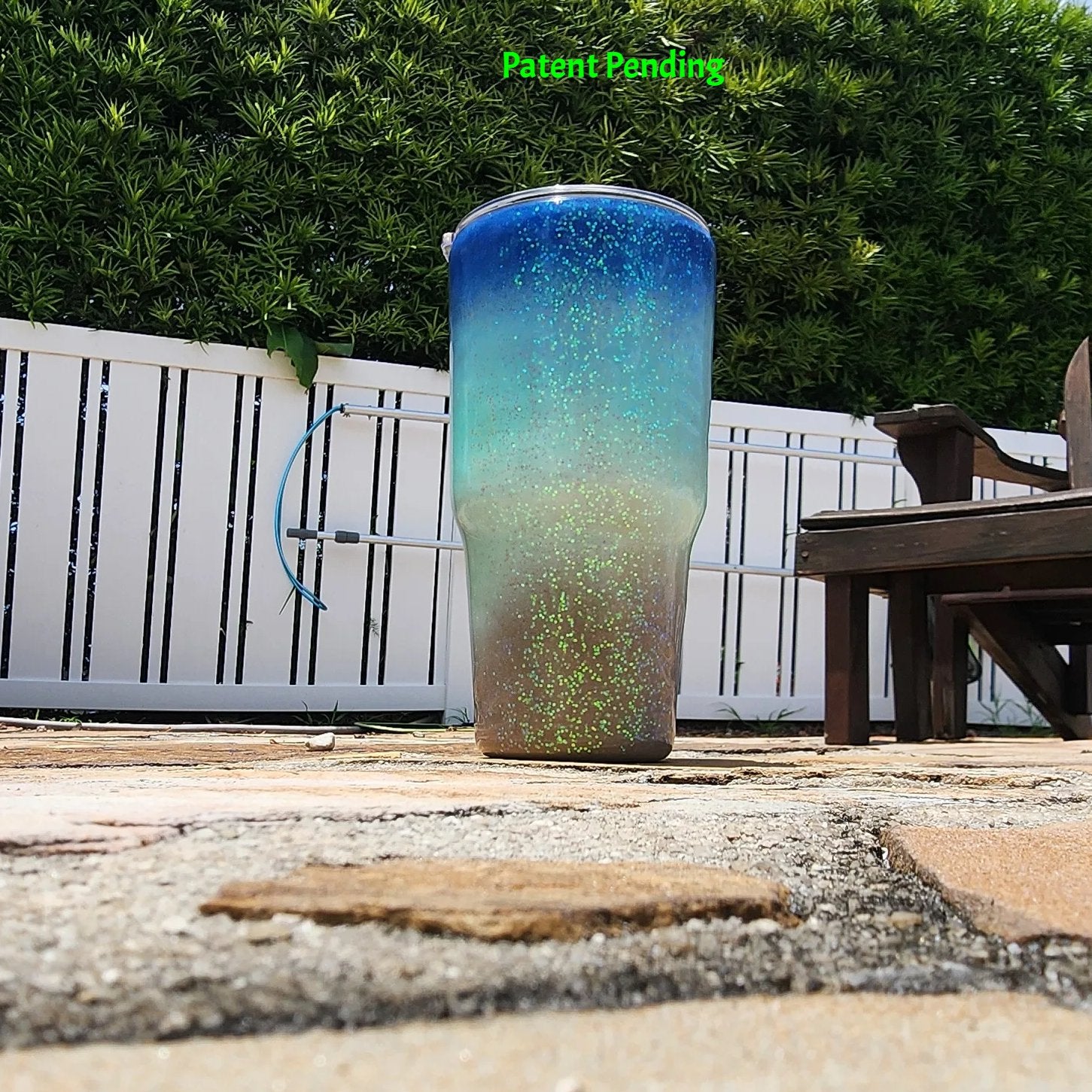 Back view of Caribbean Glow Shell Glitter 30oz tumbler showing full deep cobalt blue to crystal turquoise to sandy shore design with holographic iridescent glitter throughout. Saltwater Sips™ by SoFlo Boho Boutique, handcrafted in South Florida, Patent Pending.